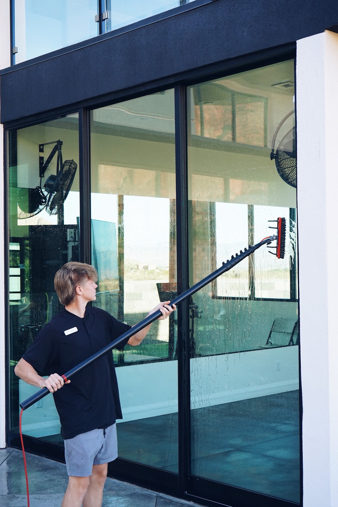 Technician cleaning a glass slider